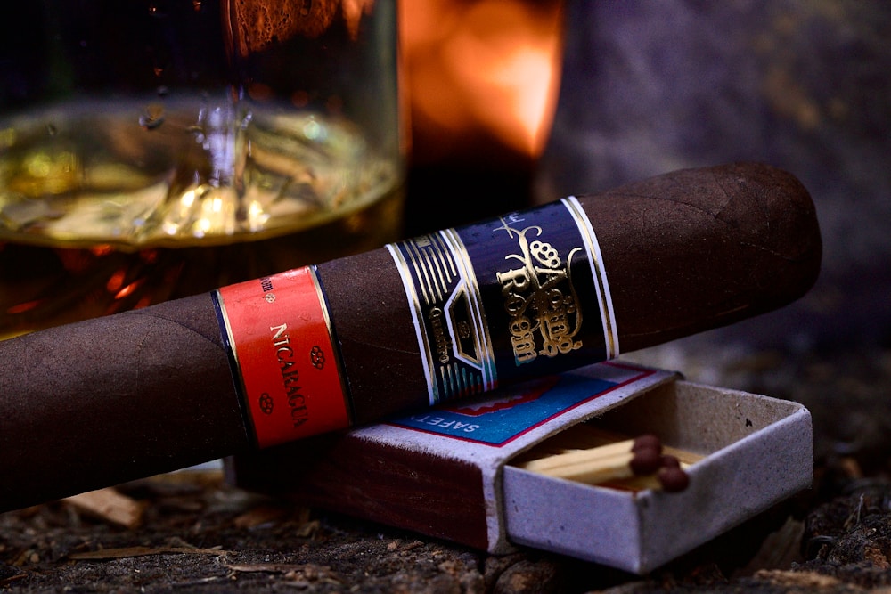 Premium cigar resting beside a refined drink for the Aloft Reserve preview