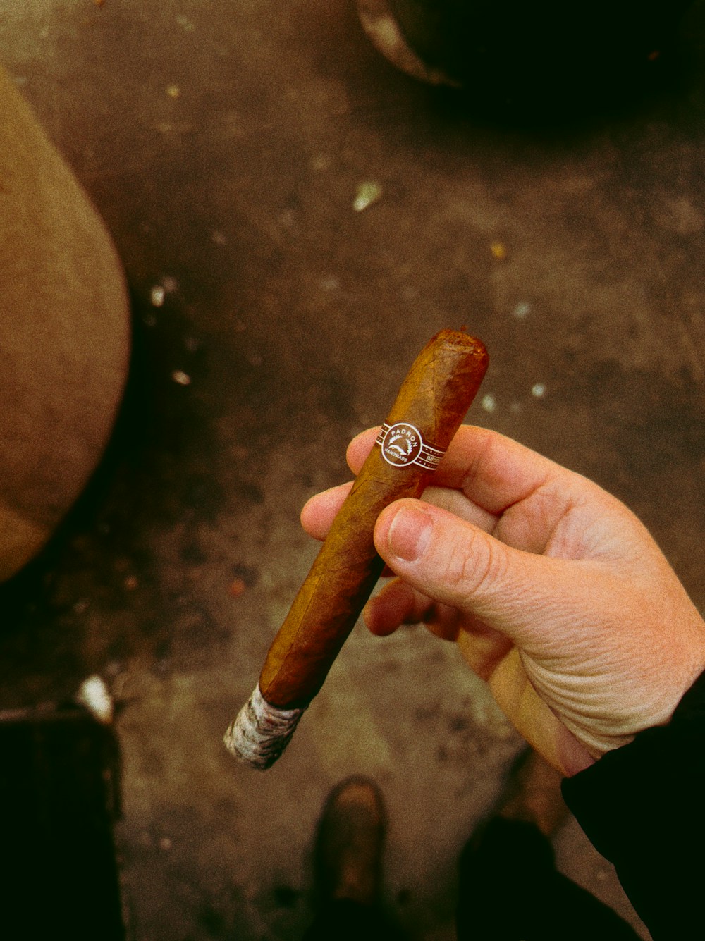 Hand-held premium cigar image for the Sanford Select preview